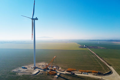 Construction site near windmill turbine, wind generator installing