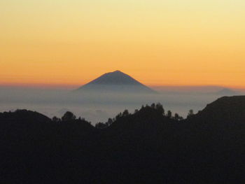 Scenic view of silhouette mountains against clear sky