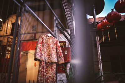 Low angle view of clothes hanging against building