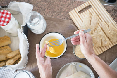High angle view of man preparing food