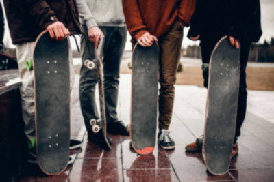 Low section of men standing in city