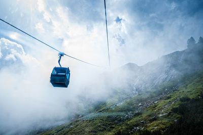 Overhead cable car against sky