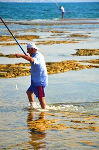 Rear view of man on beach