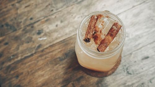 High angle view of glass of jar on table