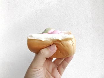 Close-up of hand holding ice cream