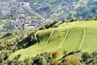 High angle view of trees and buildings in city, naturno