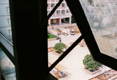 High angle view of buildings seen through window