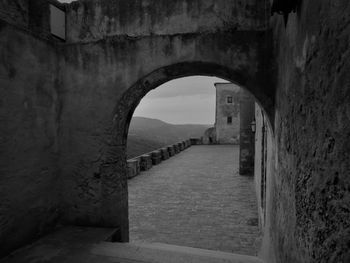 Archway of bridge against sky