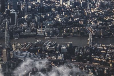 High angle view of river amidst buildings in city