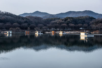 Scenic view of lake and mountains against sky