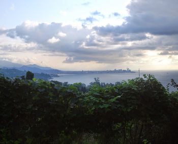 Scenic view of sea against cloudy sky