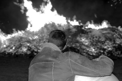 Silhouette of person against cloudy sky