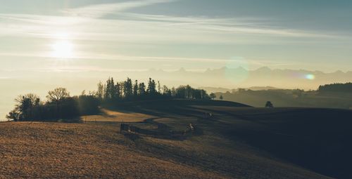 Scenic view of landscape against sky during sunset