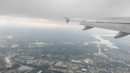 Aerial view of cityscape seen through airplane window