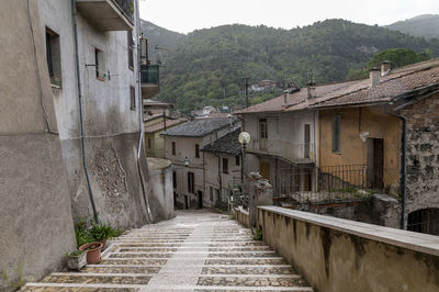 Narrow alley amidst buildings in town