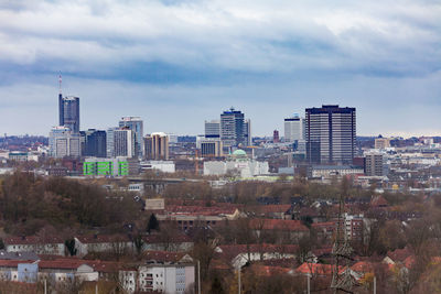 Buildings in city against sky