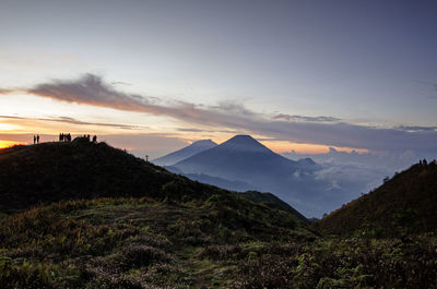 Scenic view of mountains against sky during sunset