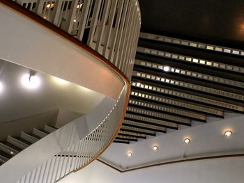 Upside down image of illuminated stairway in building