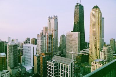 Modern building in city against clear sky