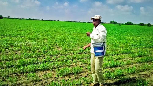 Full length of man standing in farm