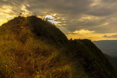 Scenic view of mountains against sky at sunset