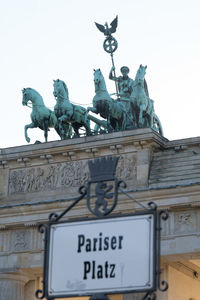 Low angle view of statue against sky