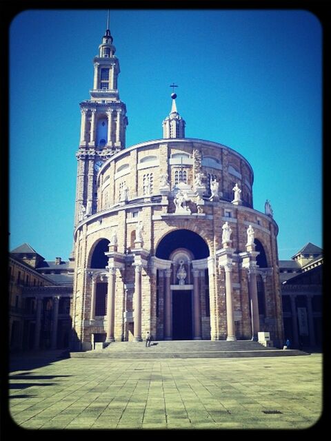 architecture, building exterior, built structure, place of worship, church, religion, clear sky, blue, spirituality, facade, transfer print, arch, low angle view, cathedral, cross, dome, auto post production filter, sunlight