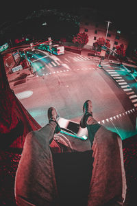 High angle view of man photographing at night