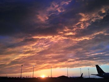 Low angle view of cloudy sky at sunset