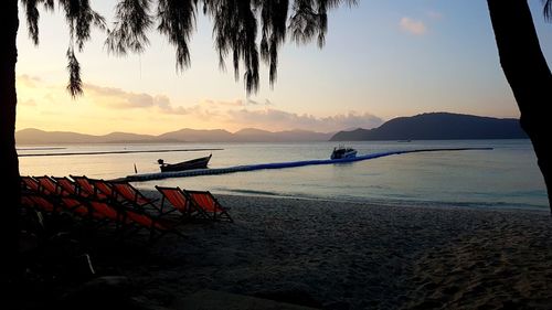 Scenic view of beach against sky during sunset