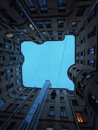 Low angle view of buildings against clear blue sky