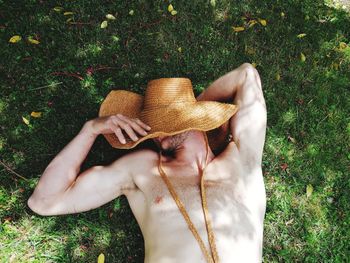 High angle view of woman lying on field