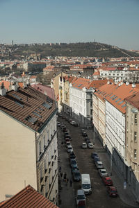 High angle view of street amidst buildings against clear sky