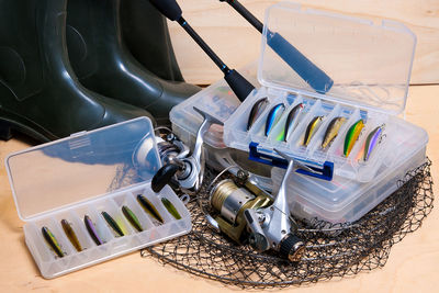 Close-up of fishing equipment on table