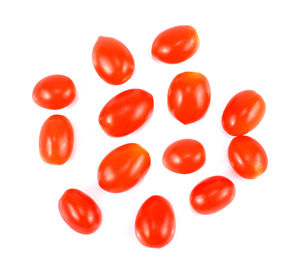 Directly above shot of red tomatoes against white background