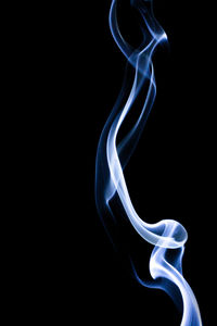 Close-up of smoke against black background