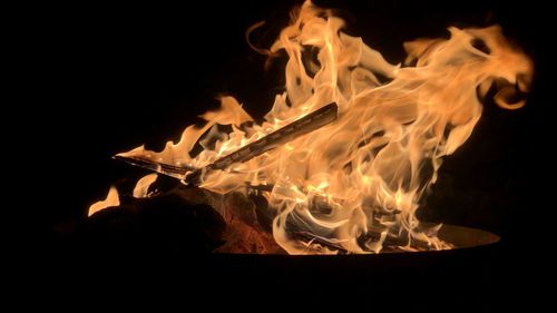 Close-up of fire against black background