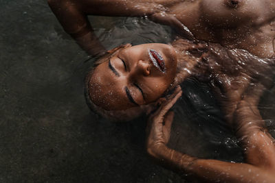 High angle view of women swimming in water