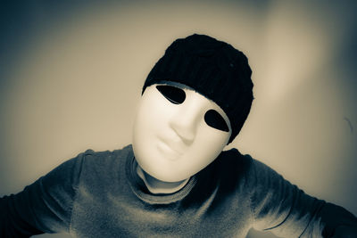 Close-up portrait of boy wearing hat