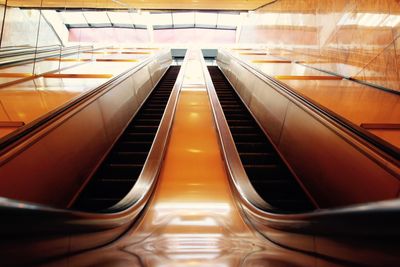 Low angle view of illuminated escalator