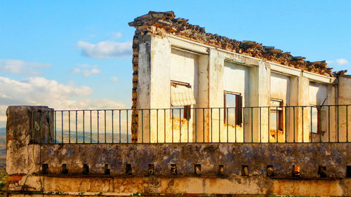 Low angle view of old built structure against sky