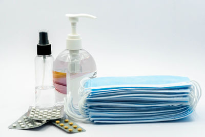 Close-up of bottle on table against white background