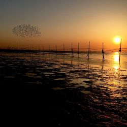 Scenic view of sea at sunset