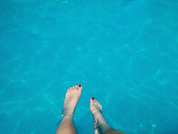 Low section of woman in swimming pool