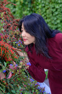 Beautiful chinese woman with long black hair on a sunny autumn day in the city.