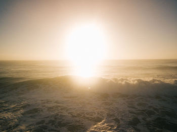 Scenic view of sea against clear sky during sunset