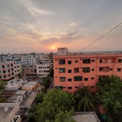 High angle view of buildings against sky during sunset