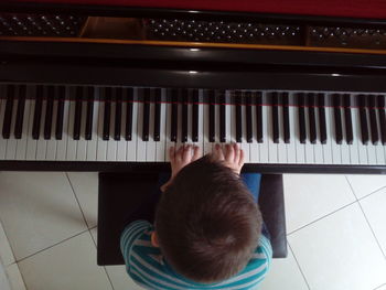 Directly above shot of man playing piano