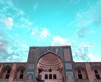 Low angle view of ornate building against sky