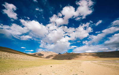 Scenic view of arid landscape against sky